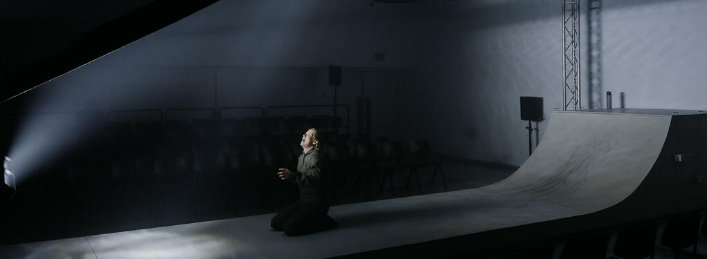 Photograph from Grounded - lighting design by Edward Saunders