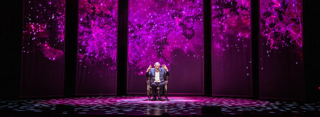 Photograph from Stephen Fry - Mythos Tour, A Trilogy Of A Shows - lighting design by Archer