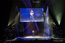 Photograph from Illusionists: Direct from Broadway - lighting design by Paul Smith